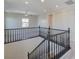 Open loft area with railing and ceiling fan at 2811 Shadows Edge Ct, Henderson, NV 89052