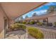 Spacious outdoor patio with a garden, walkway, and glimpses of neighboring properties at 2851 S Valley View Blvd # 1195, Las Vegas, NV 89102