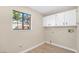 Bright laundry room with white cabinets and a window for natural light at 2851 S Valley View Blvd # 1195, Las Vegas, NV 89102