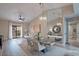 Bright living and dining area featuring modern decor, stylish lighting, and a sliding glass door to the outdoors at 2851 S Valley View Blvd # 1195, Las Vegas, NV 89102