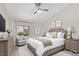 Cozy main bedroom with a queen bed, neutral walls, ceiling fan, and a bright window at 2851 S Valley View Blvd # 1195, Las Vegas, NV 89102