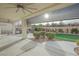 Covered patio, built-in BBQ, and grassy backyard at 2951 Maffie St, Henderson, NV 89052