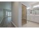 Bright bathroom with double vanity, walk-in shower, and separate toilet at 2951 Maffie St, Henderson, NV 89052
