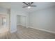 Bright bedroom with mirrored closet doors and hardwood floors at 2951 Maffie St, Henderson, NV 89052