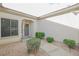 Front entry with walkway, landscaping, and a gray door at 2951 Maffie St, Henderson, NV 89052