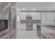 Kitchen with stainless steel appliances and stone backsplash at 2951 Maffie St, Henderson, NV 89052