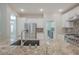 Modern kitchen with stainless steel appliances and granite countertops at 2951 Maffie St, Henderson, NV 89052