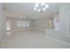 Spacious living room with tile floors and a ceiling fan at 2951 Maffie St, Henderson, NV 89052