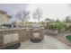Outdoor kitchen with built-in grill and stone countertops at 2951 Maffie St, Henderson, NV 89052