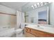 Bathroom with shower/tub combo and wood vanity at 2983 Juniper Hills Blvd # 102, Las Vegas, NV 89142