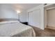 Bedroom with a double bed, sliding closet doors and carpet at 2983 Juniper Hills Blvd # 102, Las Vegas, NV 89142