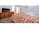 Large bedroom with king bed and wood dresser at 2983 Juniper Hills Blvd # 102, Las Vegas, NV 89142