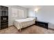 Bedroom with a double bed, dresser, and window at 2983 Juniper Hills Blvd # 102, Las Vegas, NV 89142