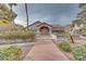 Spanish-style building exterior with a welcoming entryway at 2983 Juniper Hills Blvd # 102, Las Vegas, NV 89142