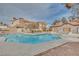 Inviting community pool with surrounding patio and building views at 2983 Juniper Hills Blvd # 102, Las Vegas, NV 89142