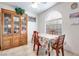 Small dining area with wooden table and hutch at 2983 Juniper Hills Blvd # 102, Las Vegas, NV 89142