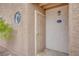 Close up front door with security gate on a sunny day at 2983 Juniper Hills Blvd # 102, Las Vegas, NV 89142