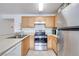 Clean kitchen featuring stainless steel appliances and wood cabinets at 2983 Juniper Hills Blvd # 102, Las Vegas, NV 89142