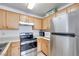 Kitchen with stainless steel appliances and light wood cabinets at 2983 Juniper Hills Blvd # 102, Las Vegas, NV 89142