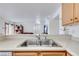 Double kitchen sink with a view into the living room at 2983 Juniper Hills Blvd # 102, Las Vegas, NV 89142