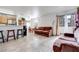 Open living room with dining area, tile flooring, and neutral color palette at 2983 Juniper Hills Blvd # 102, Las Vegas, NV 89142