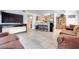 Bright living room with dining area, tile flooring, and an open concept at 2983 Juniper Hills Blvd # 102, Las Vegas, NV 89142
