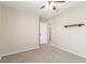 Spacious bedroom with ceiling fan and access to bathroom at 3032 Gravino Ave, Henderson, NV 89044