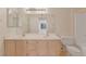 Bathroom features a dual sink vanity, a large mirror, and a toilet at 3425 E Russell Rd # 227, Las Vegas, NV 89120