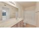 Bathroom featuring a vanity, large mirror, toilet, and shower over bath at 3425 E Russell Rd # 227, Las Vegas, NV 89120