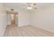 Empty bedroom featuring wood floors, ceiling fan, and an ensuite bathroom at 3425 E Russell Rd # 227, Las Vegas, NV 89120