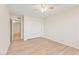 Spacious bedroom showcasing light wood floors, neutral walls, and a ceiling fan at 3425 E Russell Rd # 227, Las Vegas, NV 89120