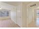 Bedroom featuring wood-look floors and closet with shutter doors, along with a neutral wall color at 3425 E Russell Rd # 227, Las Vegas, NV 89120