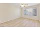 Empty bedroom featuring wood floors, ceiling fan, and neutral paint scheme at 3425 E Russell Rd # 227, Las Vegas, NV 89120