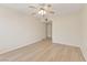 Empty bedroom featuring wood floors, ceiling fan, and neutral paint scheme at 3425 E Russell Rd # 227, Las Vegas, NV 89120