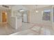 Bright kitchen with white appliances, tile floors, and natural light from a large window at 3425 E Russell Rd # 227, Las Vegas, NV 89120