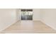 Bright living room featuring new floors and sliding glass door to the balcony at 3425 E Russell Rd # 227, Las Vegas, NV 89120