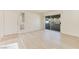 Bright living room featuring new floors and sliding glass door to the balcony at 3425 E Russell Rd # 227, Las Vegas, NV 89120