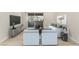 Staged living room featuring new floors, entertainment center and modern decor at 3425 E Russell Rd # 227, Las Vegas, NV 89120