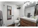 Simple bathroom with wood vanity and black fixtures at 3585 Arville St # 402C, Las Vegas, NV 89103