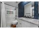 Modern bathroom with marble tile, a white vanity, and a shower/tub combo at 3585 Arville St # 402C, Las Vegas, NV 89103