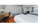 Bedroom with a desk, queen bed, and mirrored closet at 3585 Arville St # 402C, Las Vegas, NV 89103