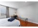 Bedroom with a queen bed, desk, and wood floors at 3585 Arville St # 402C, Las Vegas, NV 89103