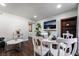 White table and chairs in bright dining area near TV at 3585 Arville St # 402C, Las Vegas, NV 89103