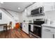 Modern kitchen with stainless steel appliances and white cabinetry at 3585 Arville St # 402C, Las Vegas, NV 89103