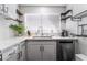 White kitchen with quartz countertops and modern sink at 3585 Arville St # 402C, Las Vegas, NV 89103