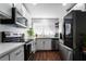 Updated kitchen featuring stainless steel appliances and wood flooring at 3585 Arville St # 402C, Las Vegas, NV 89103