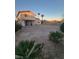 Large backyard with desert landscaping and a patio at 4079 E Saint Louis Ave, Las Vegas, NV 89104