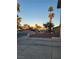 House front yard with a palm tree and a small fence at 4079 E Saint Louis Ave, Las Vegas, NV 89104