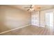 Bedroom featuring neutral walls, hardwood floors, a closet and a ceiling fan at 4720 E Wyoming Ave, Las Vegas, NV 89104