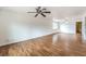 Spacious living room featuring hardwood floors, ceiling fans, and natural light at 4720 E Wyoming Ave, Las Vegas, NV 89104